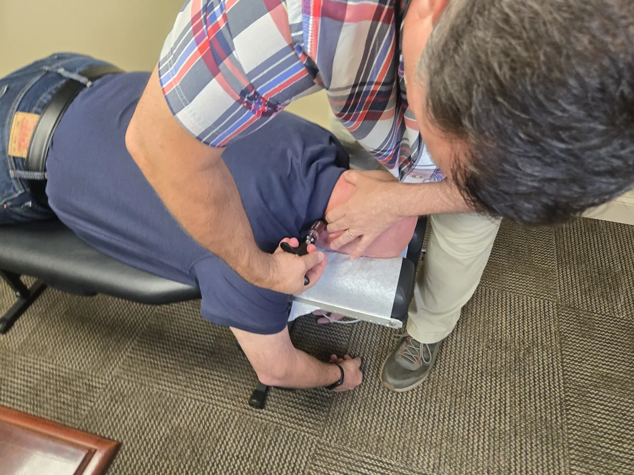 Close-up of Dr. McCarley delivering a hands-on spinal adjustment