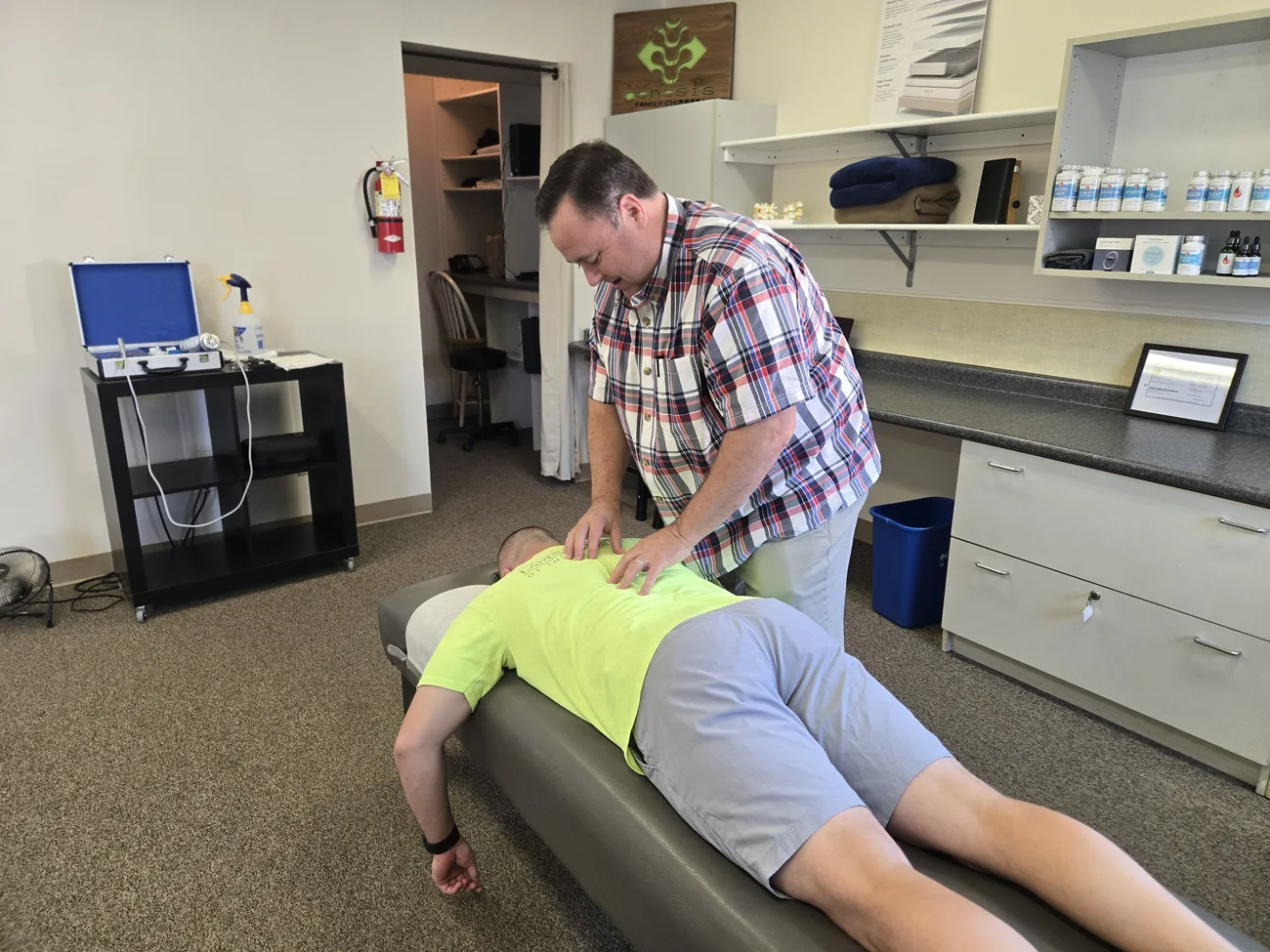 Hi-vis worker receiving treatment on the portable table